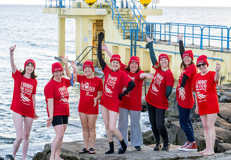 group cope galway staff and volunteers at christmas swim